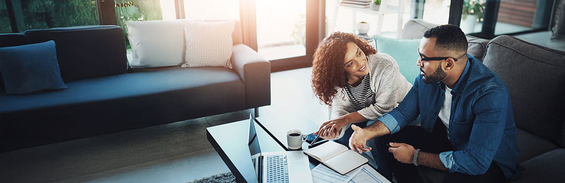A couple having a conversation in thier living room.